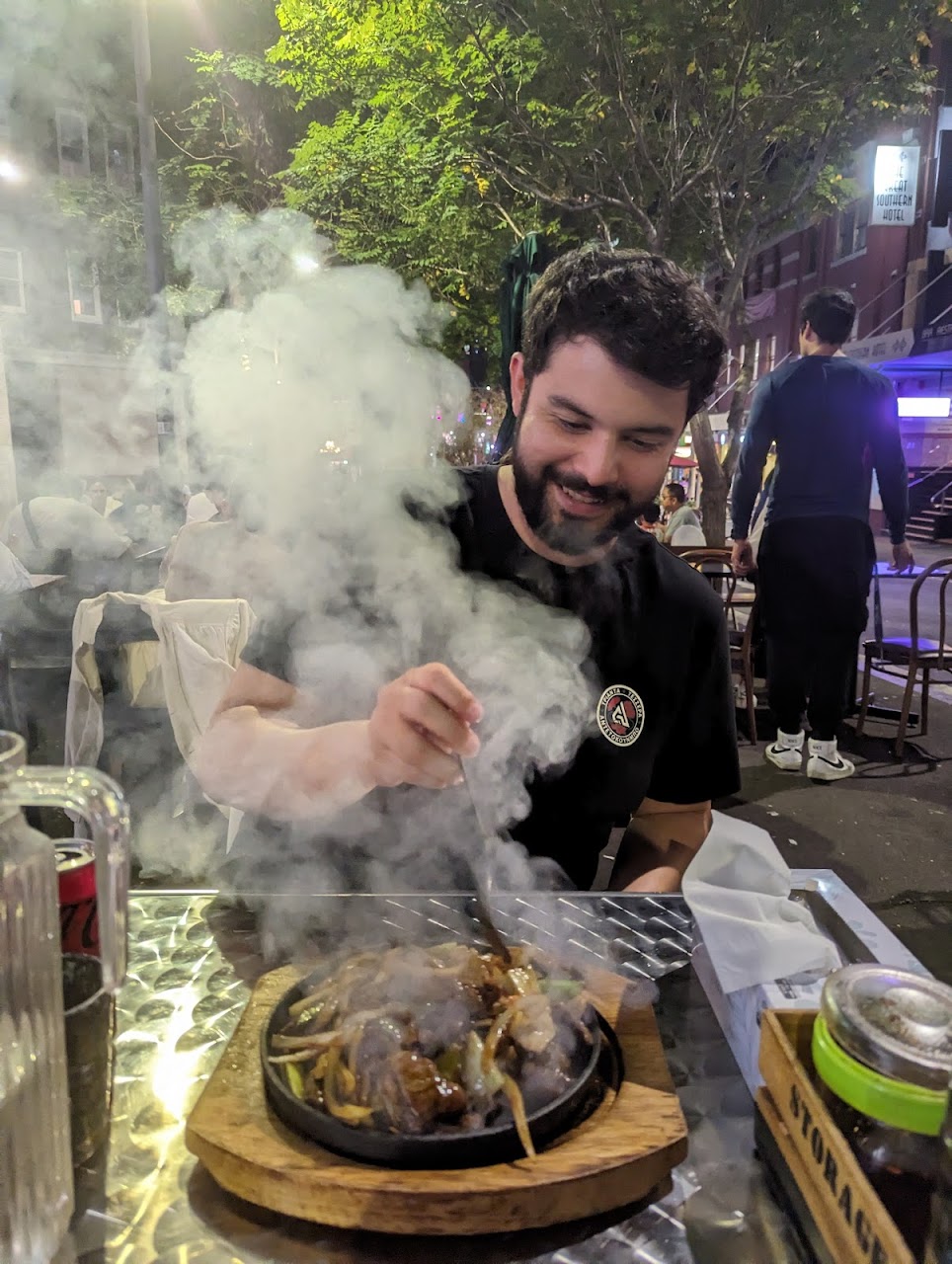 A sizzling dish served at an outdoor Chinatown Sizzling House table